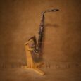 20250707_2230_Saxophone on Wood Stand_remix_01jzjx7vfxeavve7nrh3q6et41